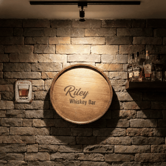 Custom engraved Whiskey display barrel top used as a wall decoration