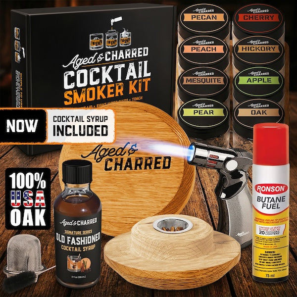 Aged & Charred cocktail smoker kit includes Smoke Lid made from 100% oak, 8 wood chips flavors, a culinary torch, butane and our Aged & Charred Signature Syrup all packaged in a handsome gift box