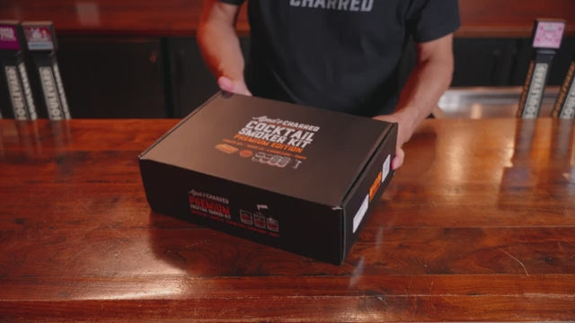 Video showing Premium cocktail smoker lid kit that includes wooden box, Smoke Lid, 8 wood chip flavors, culinary torch, butane, recipe book and syrup. 