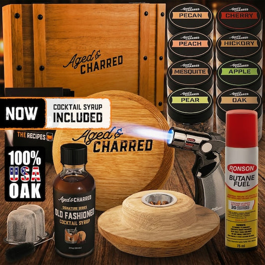 Premium cocktail smoker lid kit includes wooden box, Smoke Lid, 8 wood chip flavors, culinary torch, butane, recipe book and syrup. 