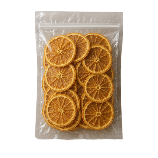 Packaged dried orange slices in a clear plastic bag on a white background