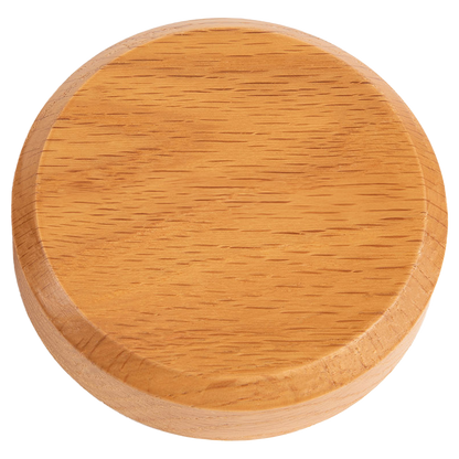 A wooden round smoke lid for a cocktail smoker.