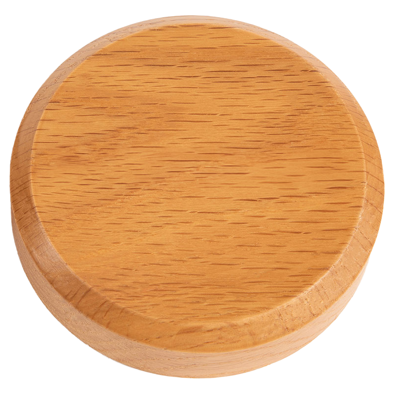 A wooden round smoke lid for a cocktail smoker.