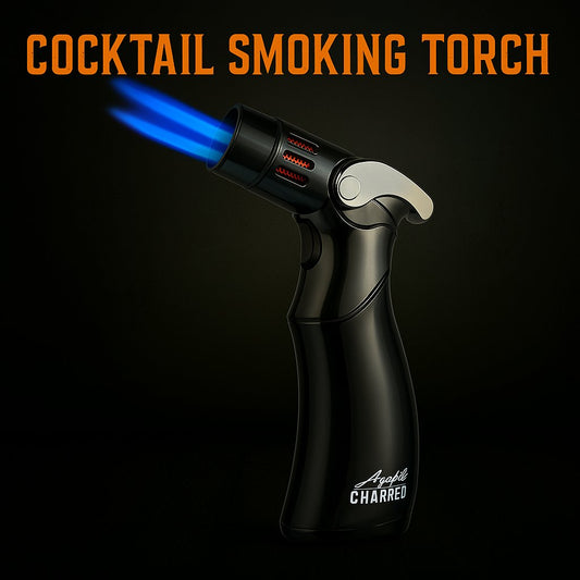A black cocktail smoking torch with a blue flame, featuring a metallic accent and Aged & Charred logo on the side.
